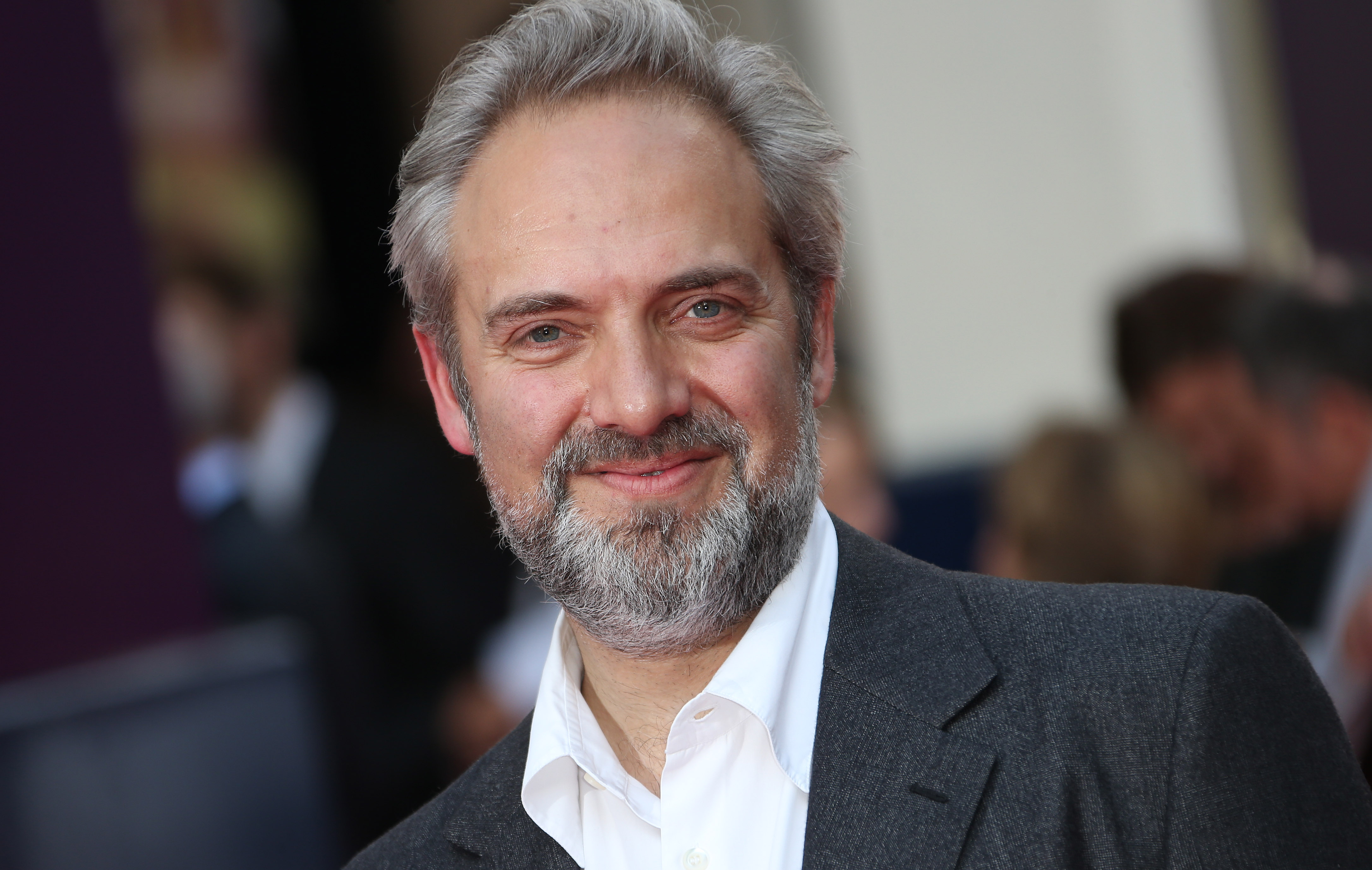 FILE - In this June 25, 2013 file photo, director Sam Mendes arrives for the opening night of the musical "Charlie and the Chocolate Factory," at the Drury Lane Theatre in central London. Mendes is coming back to direct another James Bond film with Daniel Craig following the enormously successful Skyfall. Mendes had suggested Skyfall would be his lone entry in the 007 canon, but Bond producers and Sony Pictures announced his return Thursday, July 11. (Photo by Joel Ryan/Invision/AP, File)